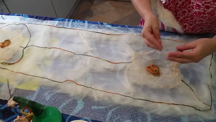 Add small wisps of wool over silk areas to act as glue during felting.