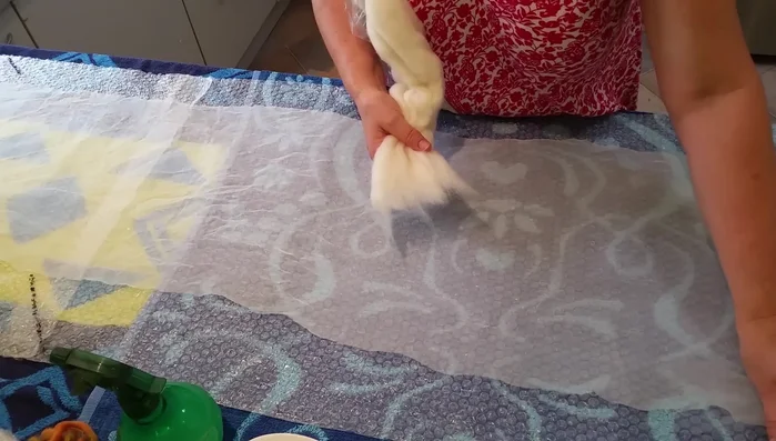 Add small wisps of wool over silk areas to act as glue during felting.