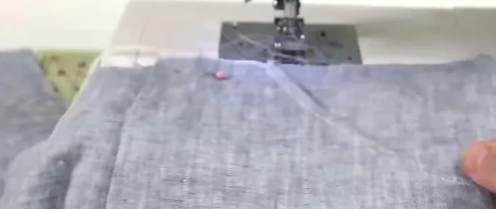 Attach pockets to the skirt front and back, securing them with basting stitches and then a double row of straight stitches along the curved pocket edges.