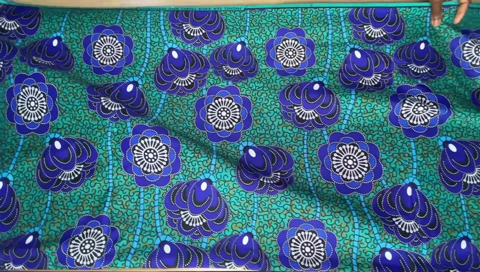 Prepare the fabric: Fold the fabric in half (right side to right side), then in half again to create four layers.