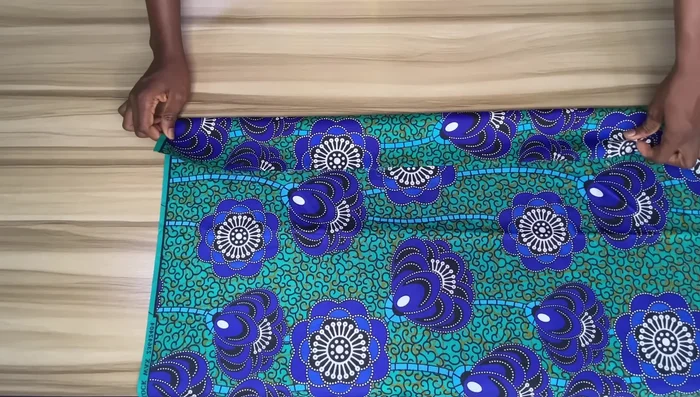 Prepare the waistband: Cut a waistband piece, adding extra width and length for seam allowance. Apply gum stay to the wrong side, press, and fold in half. Press again and fold one edge inward by half an inch. Press.