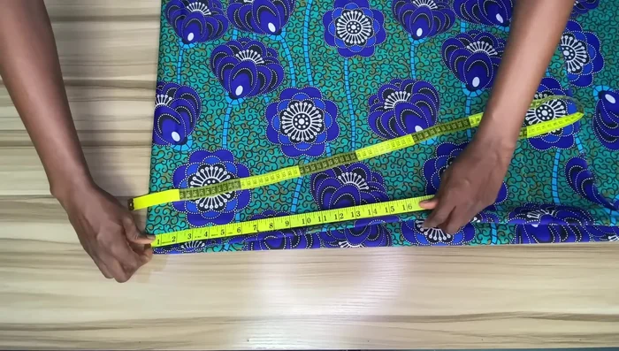 Measure and mark the skirt length: Measure your desired skirt length (minus waistband allowance and add seam allowance), and mark points around the fabric from the waistline to create a curved hemline.