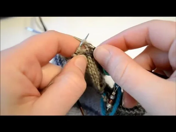 Repeat step 3: Continue knitting front and back for the next 21 stitches to create the other half of the flap.