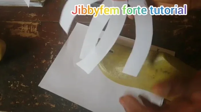 Interlock the two cuff shapes to create the first slide design. Adjust width as desired.