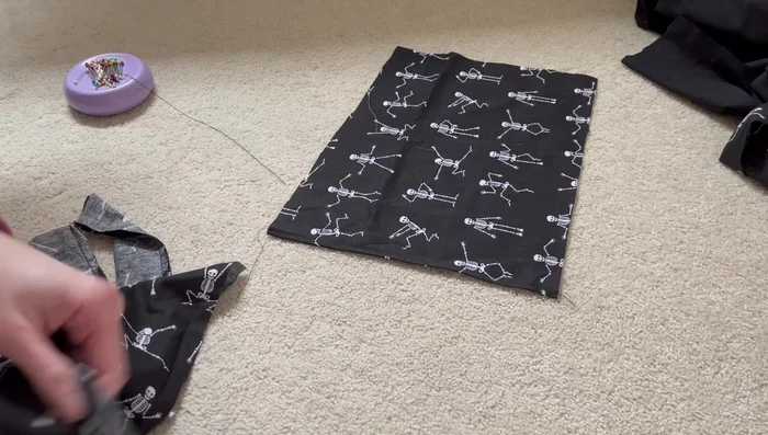 Sew all the cover pieces together, leaving an opening for inserting the pillow. Remember to insert the handles between the front and back cover pieces during this step.