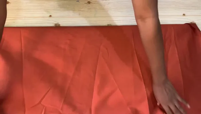 Measure and mark the sleeve length (20 inches + 1-inch seam allowance), armhole depth (7 inches), and wrist circumference (divided by two, plus seam allowance). Connect these points to complete the sleeve pattern.