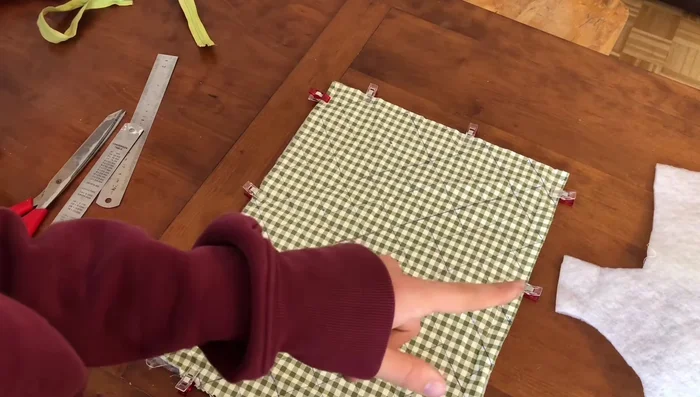 Iron Fabric: Iron the fabric to remove the pen markings.