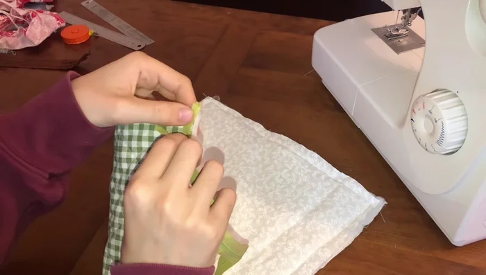 Sew Zipper: Use a zipper foot to sew the zipper onto the fabric, keeping the stitching close to the zipper teeth.