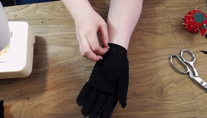 Fold and stitch the wrist area to create a cuff for a standard glove.