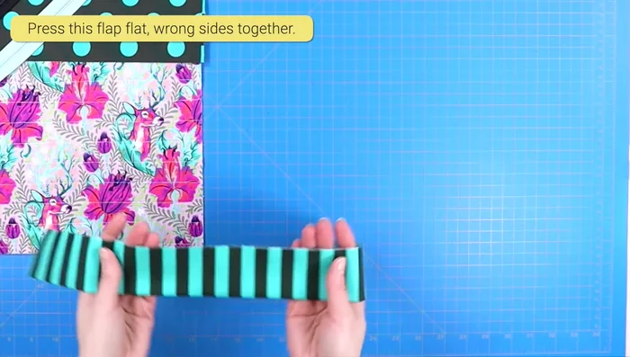 Fold the 4-inch strip in half (wrong sides together), press.
