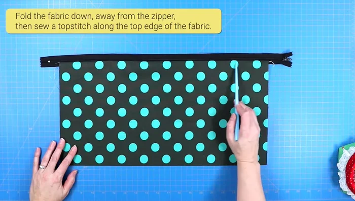 Secure zipper ends with a wide zigzag stitch to prevent teeth from separating. Trim excess zipper.