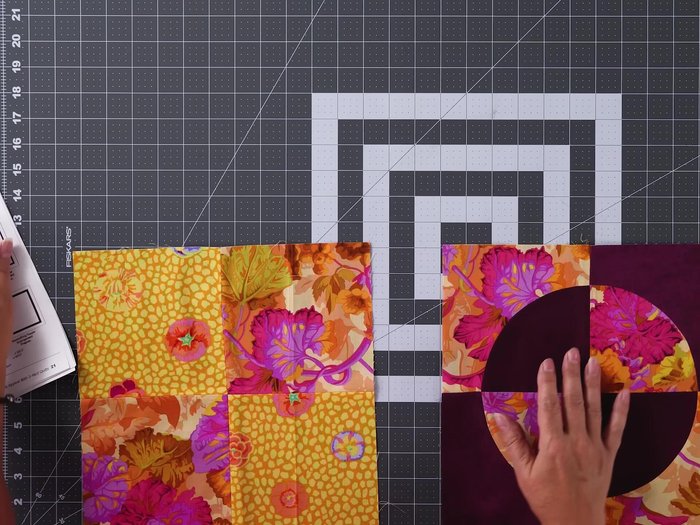 Quilt Assembly: Lay out blocks, sew rows together, and then sew rows together to complete the quilt top.