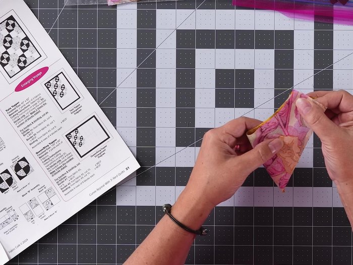 Assemble Unit A: Fold fabric pieces in half (right sides together), finger press to crease. Pin and sew curved pieces together using a scant 1/4 inch seam. Press seams open. Repeat for all Unit A pieces.