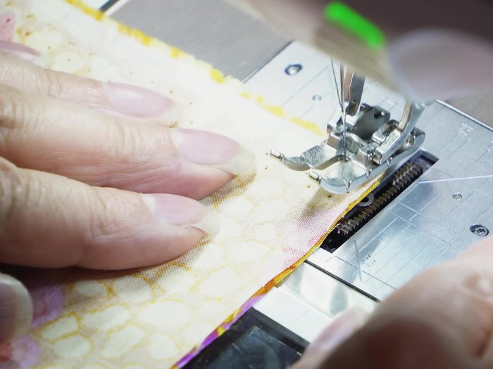 Assemble Unit C: Sew long fabric strips (Fabric 1 and Fabric 2) together. Cut into units.