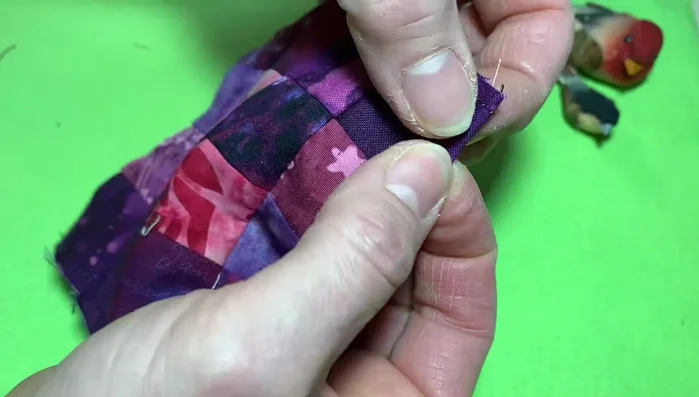 Trim the corners of the patches to make them lay flat.