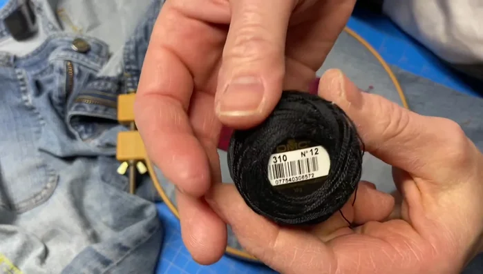 Embroider around the perimeter of the patch with a blanket stitch and straight stitch in thinner areas.