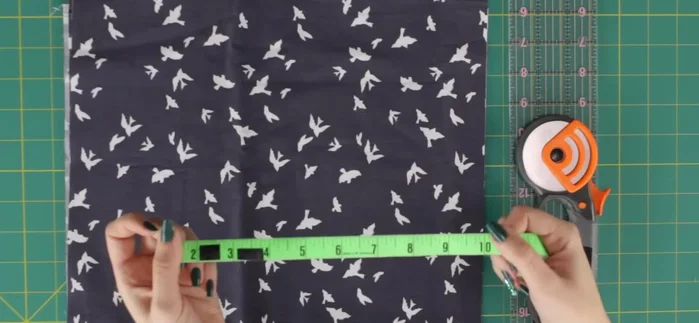 Determine fabric width based on buckle and desired belt width; add 1 inch for seam allowance. Cut fabric and interfacing to the calculated dimensions.