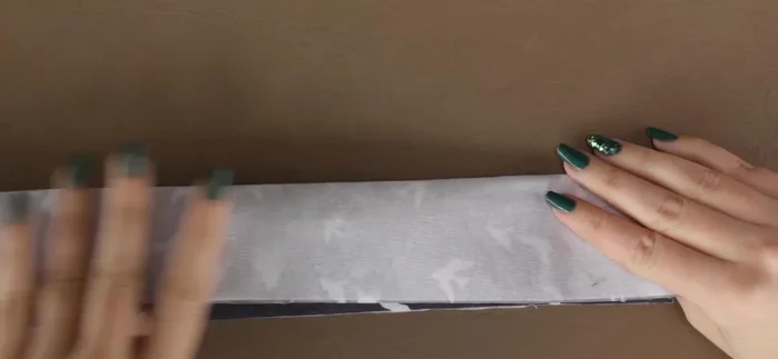 Trim seam allowance, leaving ¼ inch. Draw desired shape on one end and stitch along the line.