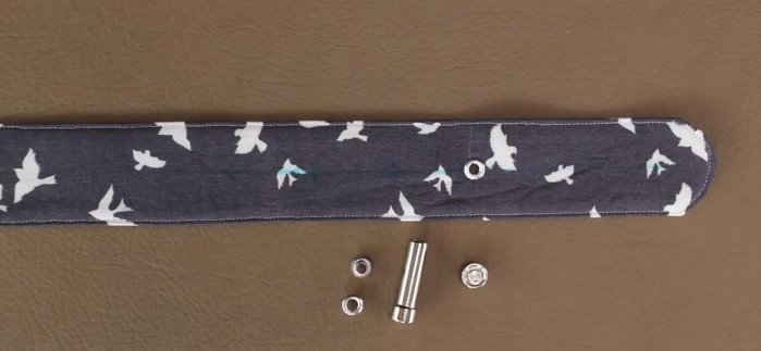 Mark and add additional eyelets to the other end of the belt, spaced approximately 1 ¼ inches apart, using the same method as before.