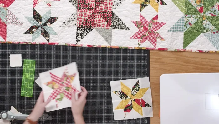 Sew two small star blocks together to match the height of the large star block.