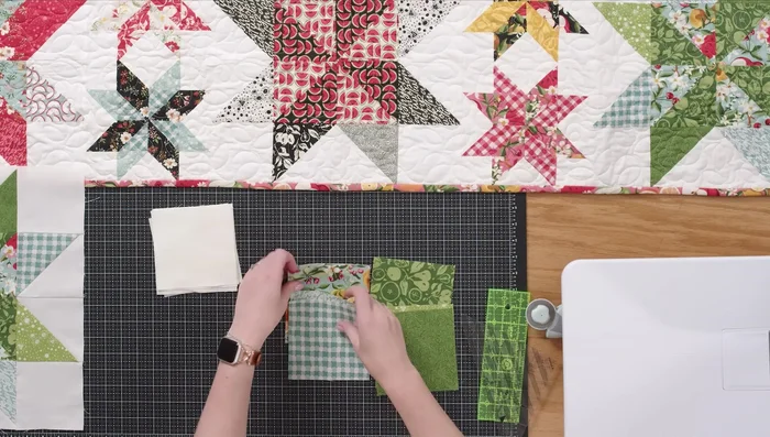 Gather fabrics: two of each contrasting print (fruit, yellow), two background fabrics, and four 2.5in background squares.