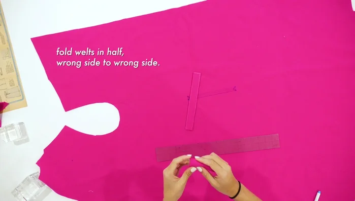 Stitch the rectangle, pin welts to the front of the garment, and stitch point-to-point.