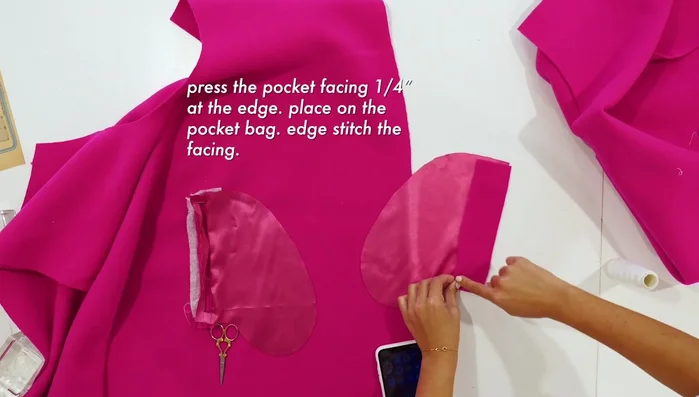 Press the pocket facing and top stitch.