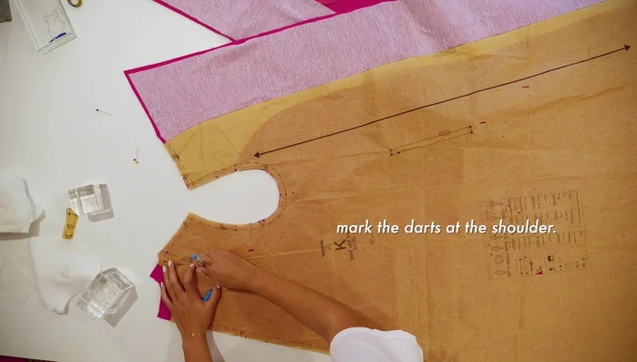 Pin the under collar to the shoulders and back neck, sew at ½ inch seam allowance, and optionally baste before machine stitching.