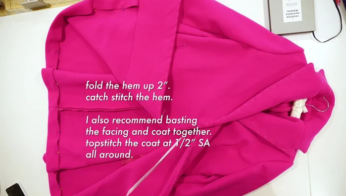 Fold and catch stitch the hem, basting the facing and coat together first, then top stitch at ½ inch seam allowance.