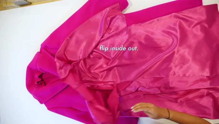 Clip the back neck lining to the stitching.