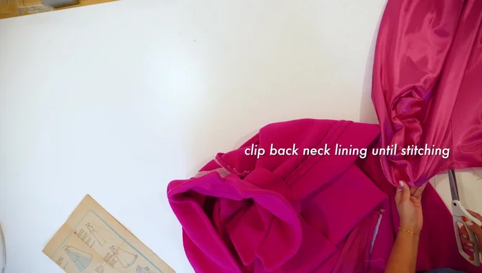 Clip the back neck lining to the stitching.