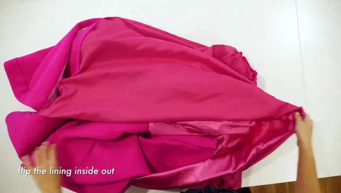 Fold raw edge down ¼ inch and slip stitch the hem.