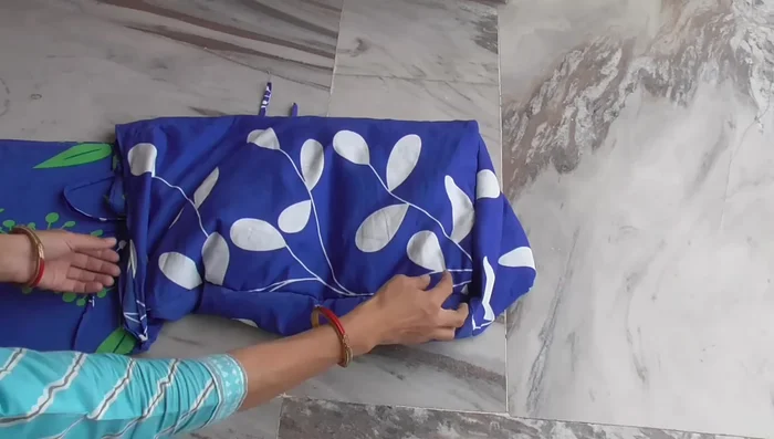 Cut pieces of cardboard to fit inside the pockets and base for added structure. Insert the cardboards and tie the strings to close.