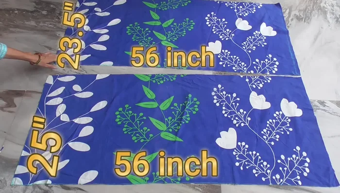 Cut two rectangular pieces from the old bedsheet. One slightly larger than the other (56 inches x 25 inches and 56 inches x 23.5 inches).
