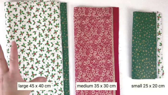 Cut fabric: Cut two pieces each of outer and inner fabric in three sizes (45x40cm, 35x30cm, 25x20cm). Ensure pattern direction is consistent.
