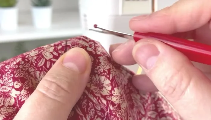 Create drawstring channel: Carefully undo the stitches between the two inner stitching lines to create a channel for the ribbon.