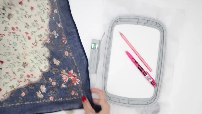 Mark your scarf and stabilizer: Accurately mark the desired embroidery placement on both the scarf and the stabilizer. Use a method that will easily remove later. Align the marks to ensure precise placement.