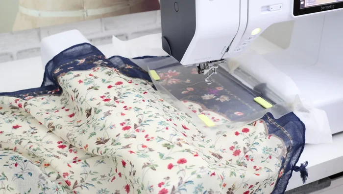 Position the hoop in the machine: Center the needle over the desired embroidery starting point.