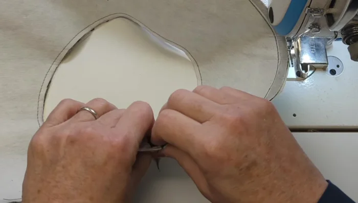 Finish and topstitch brim edges.