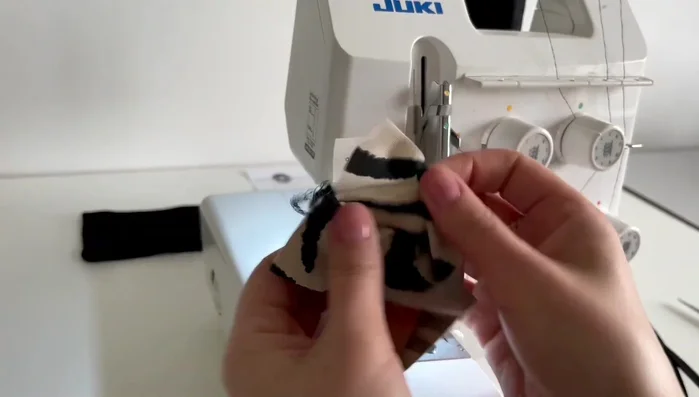 Turn the fabric right side out through the open edges.