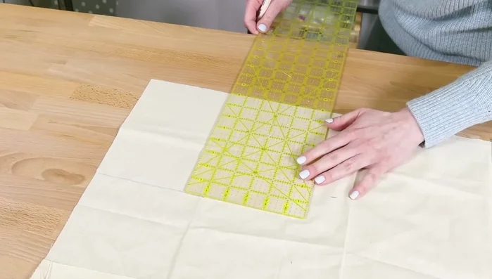 Fuse interfacing: Center stabilizer on back of outer pieces and upper lining pieces. Press for 10 seconds per section. Repeat for other pieces.