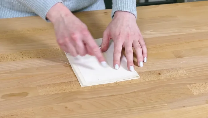 Prepare pocket: Fold pocket in half, stabilizer out. Clip corners, turn right-side out.