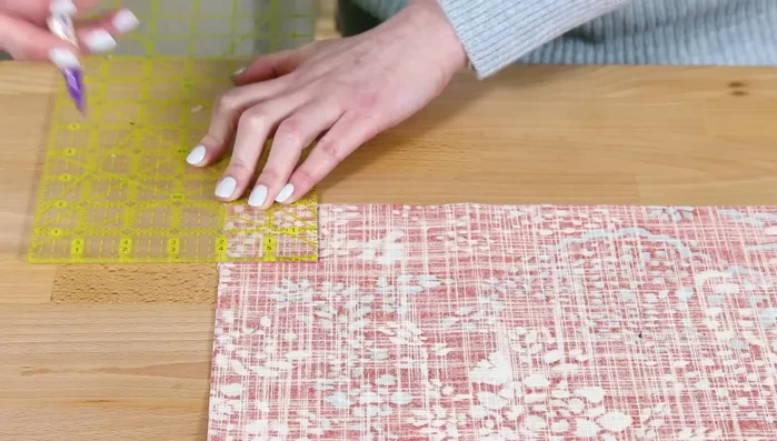 Cut upper lining pieces: Cut two lining fabric pieces 2.5 inches high and same width as other pieces. These will be visible above the zipper.