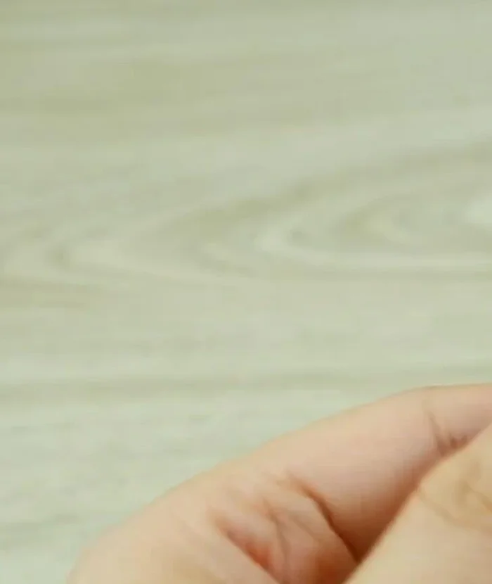 Insert the headband: Insert the headband, ensuring the seams are on the side. Secure the fabric to the headband using a hot glue gun or fabric glue.