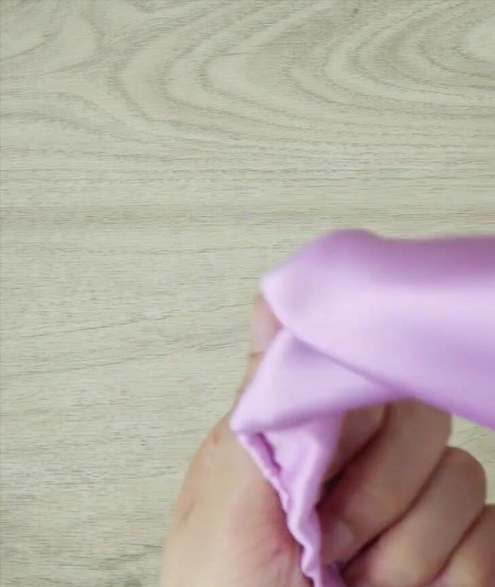 Twist the headband: Twist the headband to your desired tightness, hiding the seam as you go.