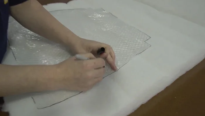 Cut foam to the size of the seat bottom, adding extra for a more attractive look.