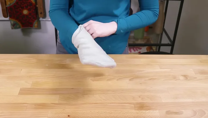 Turn the fleece mitten right side out. Repeat steps 4 and 5 for the faux fur lining.