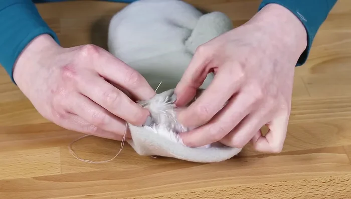 Hand sew the gap closed using a hidden stitch. Repeat for the other mitten.