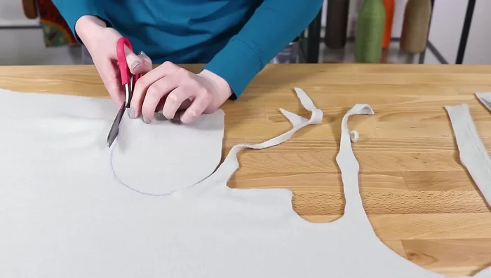 Lay out the faux fur (wrong side up). Flip over the pattern pieces and trace. Use short snips when cutting the faux fur to avoid cutting the pile too much.