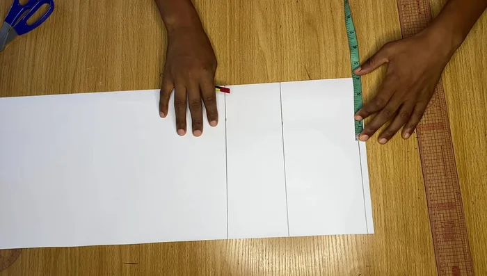 Measure straight from the top point (4 inches in) to the bicep line, divide by two, and mark the midpoint. Connect the top point, midpoint, and bicep point with smooth curves using a French curve or freehand.